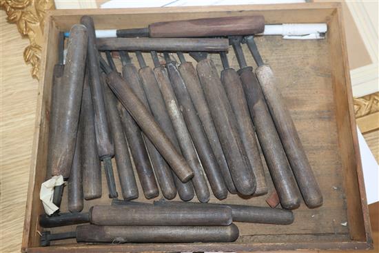 A collection of carpentry and bookbinding tools